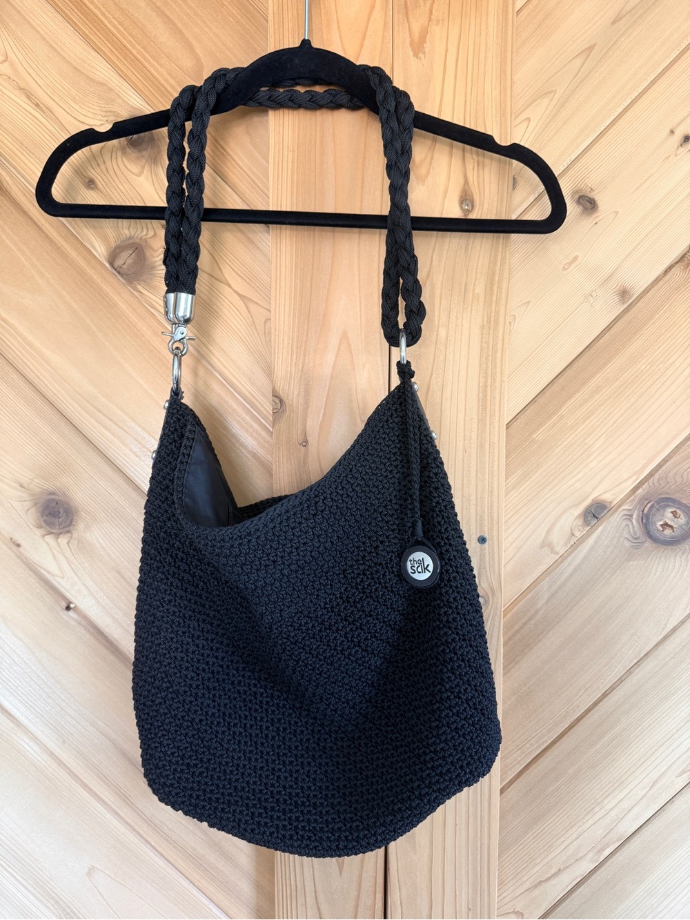The Sak Black Crochet Hobo Shoulder Bag with Adjustable Braided Strap